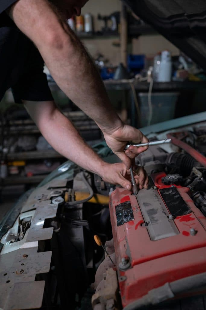 The engine of a luxury car being checked by mechanical engineer