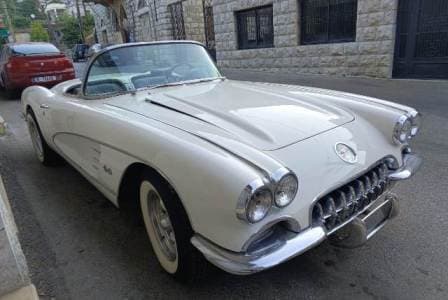 Convertible Corvette wedding car parked in an old Lebanese village