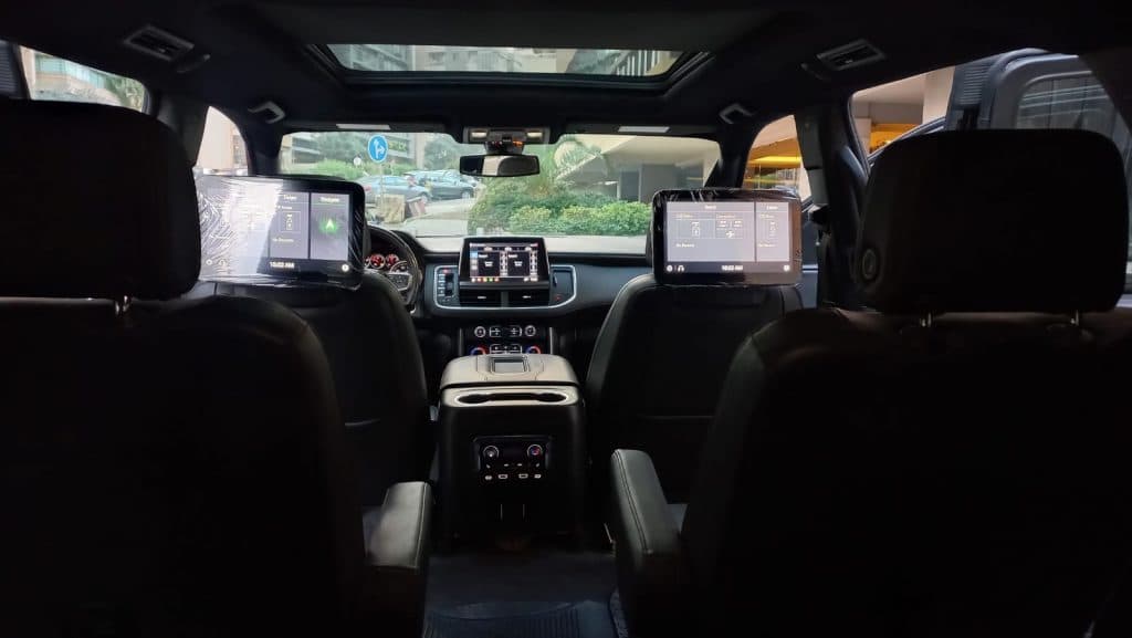 Luxurious interior of the Tahoe 2023 showing seats and digital screens inside
