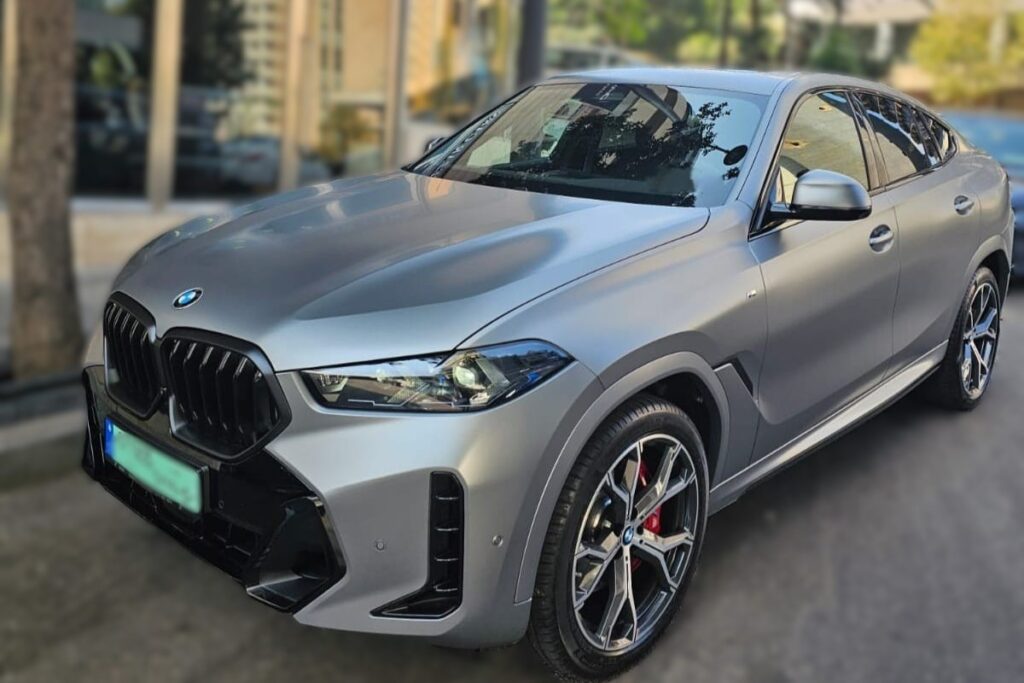 BMW X6 2026 silver parked on Beirut street showing front right angle