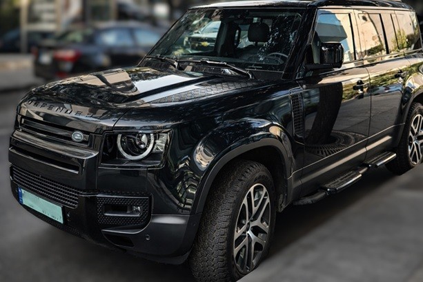 Land Rover Defender black parked on city street in Lebanon